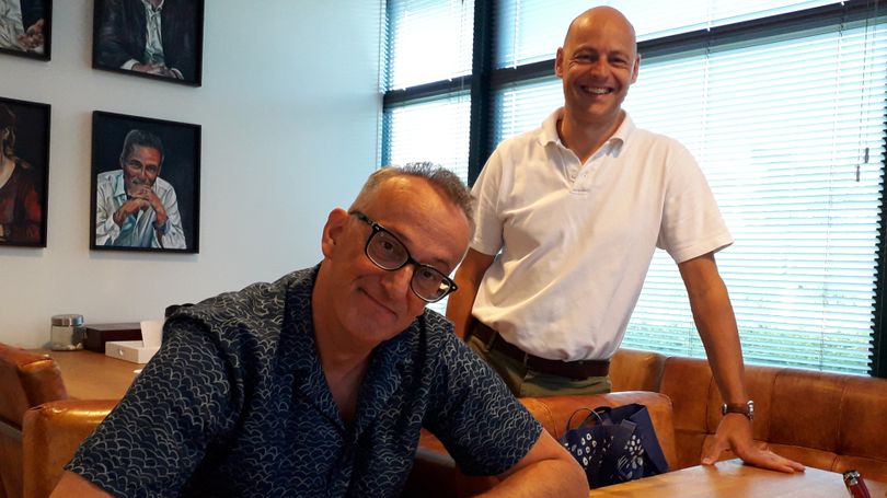 New employee signing contract with Marc Perquin Operational Manager (smiling in the background) New employee signing contract with Marc Perquin Operational Manager (smiling in the background)