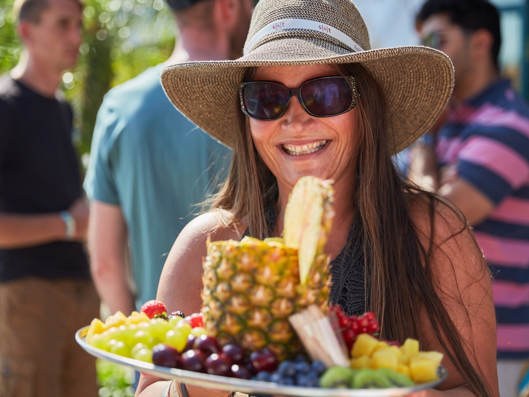 One of our founders, Carina Maas-Olij with a wonderful fruit salad during our Caribbean beach-party, at our parking lot in 2020