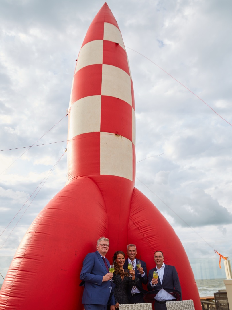 Our founders in front of a huge inflatable rocket of Kuifje during the 20-year anniversary party of S[&]T Corp, in September 2020