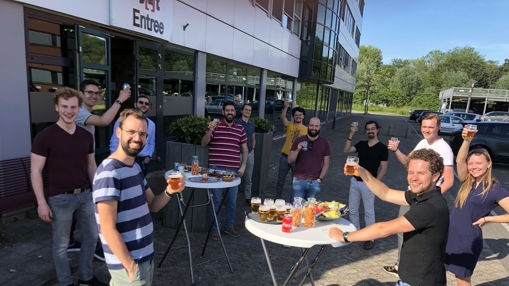 Teams of S[&]T in the parking lot, enjoying a cold one in the sun. Welcome to the team!